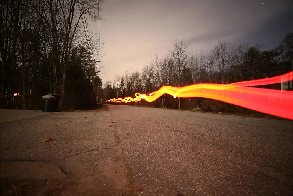 A light streak in a slow exposure photo, Kennebunk Maine.