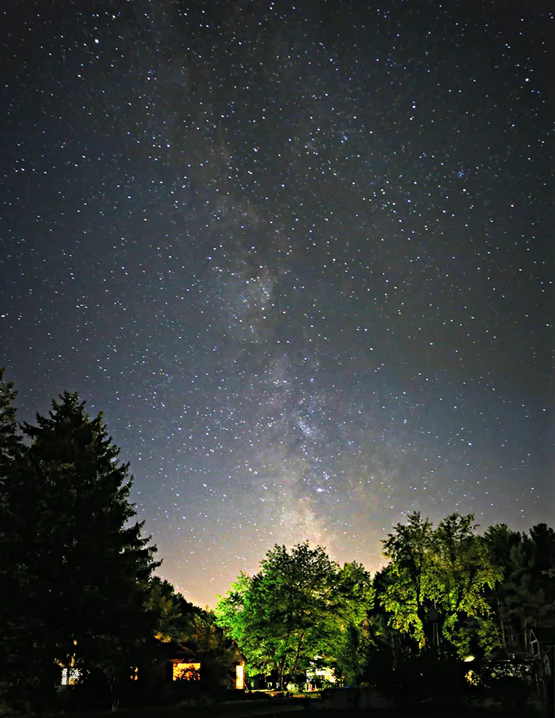 A slow exposure photo of the Milkway rising over Kennebunk, Maine.